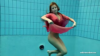 Big tits Silvie swims and shows hairy pussy